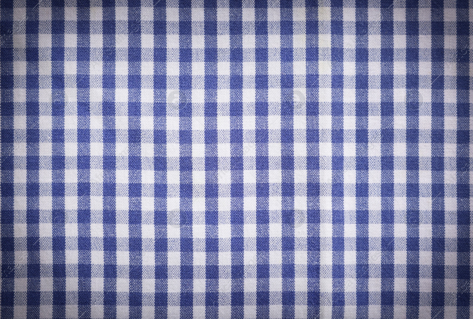 Image of Blue and white tablecloth as background, vignette effect