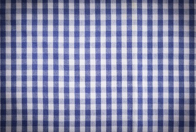 Blue and white tablecloth as background, vignette effect