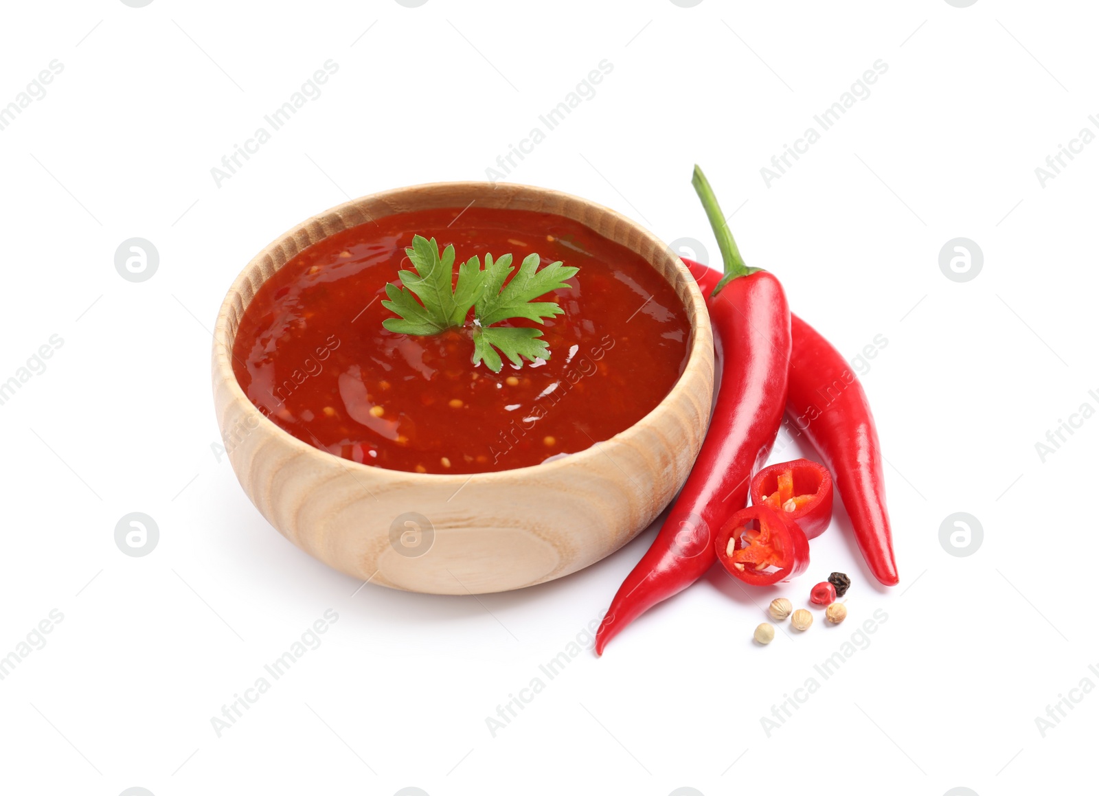 Photo of Fresh spicy chili sauce on white background