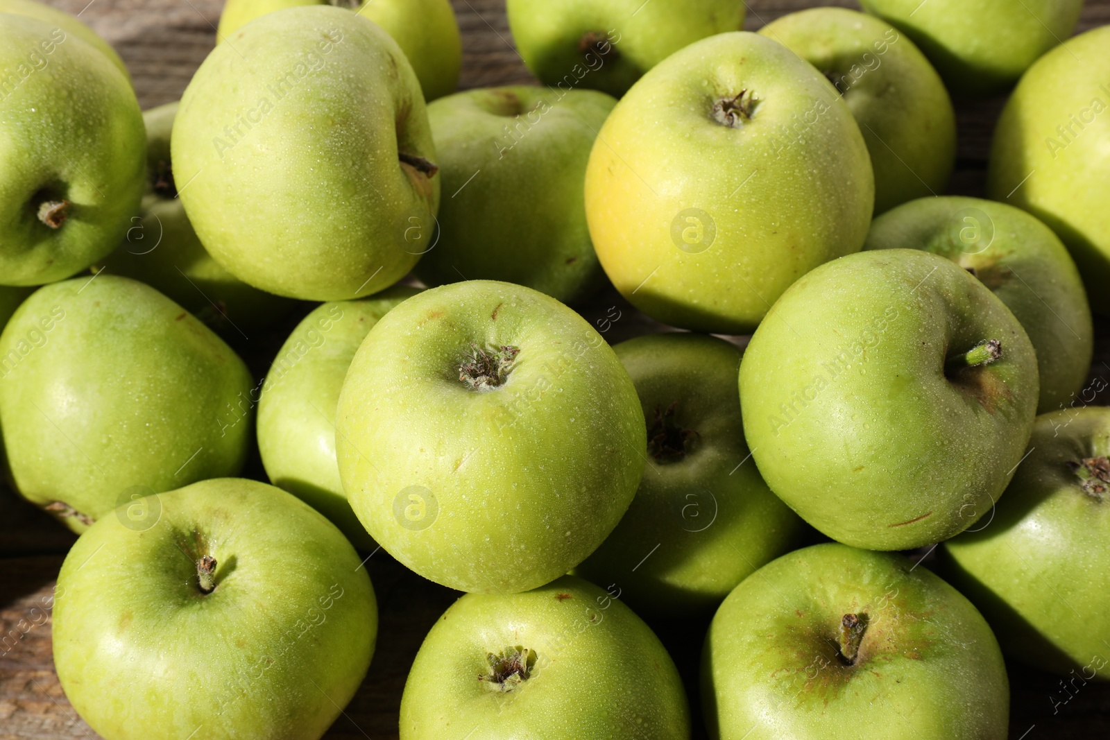 Photo of Many fresh apples on wooden table, above view