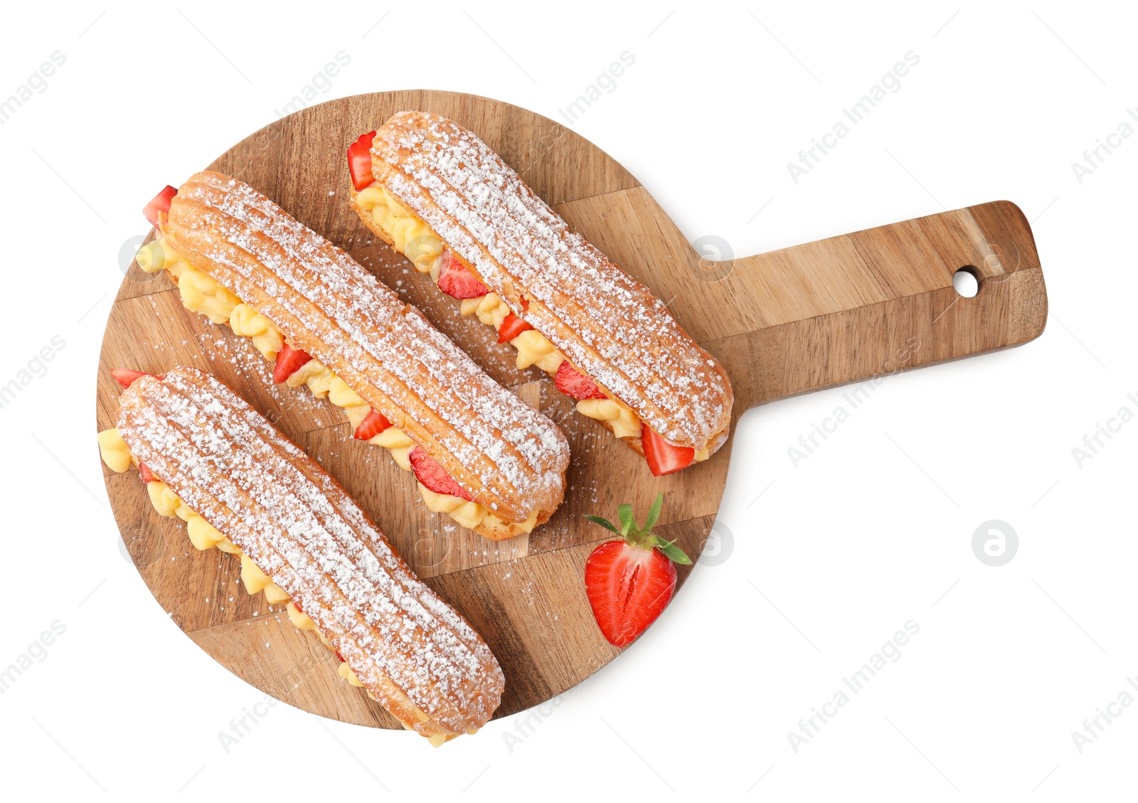 Photo of Delicious eclairs filled with cream and strawberries isolated on white, top view