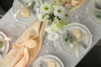 Festive table setting with beautiful floral decor, flat lay