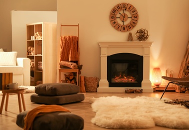 Photo of Beautiful view of cozy living room interior with fireplace