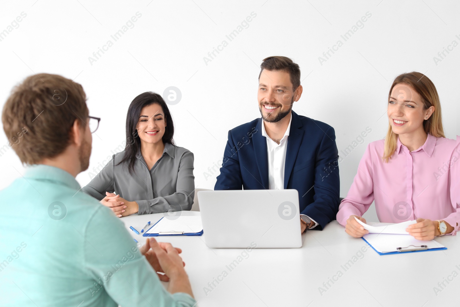 Photo of Human resources commission conducting job interview with applicant in office