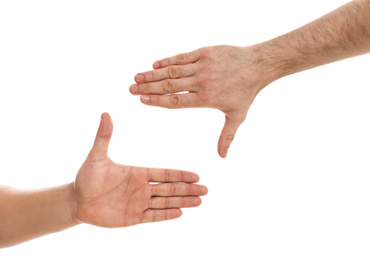 Man making frame with his hands on white background, closeup