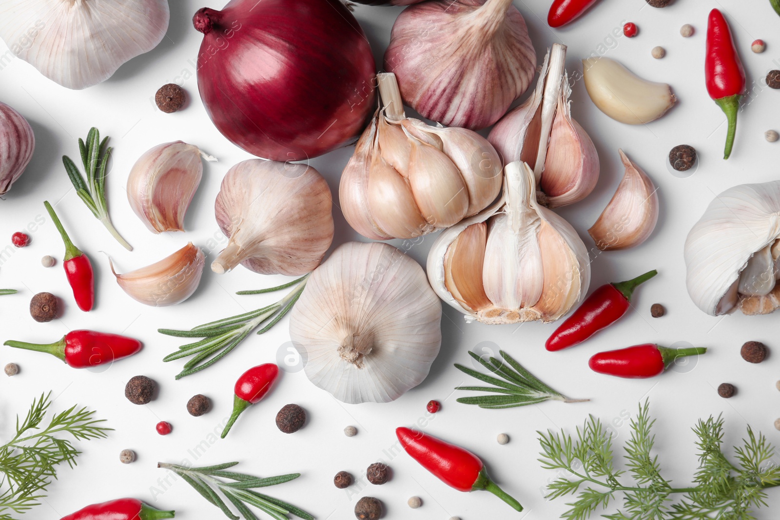 Photo of Composition with garlic, peppers and onions on white background, top view