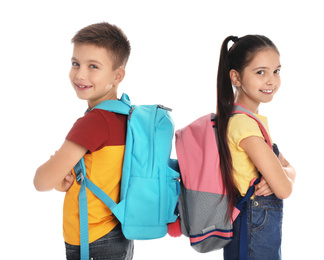 Little school children with backpacks on white background