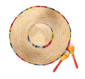 Photo of Mexican sombrero hat and maracas isolated on white, top view