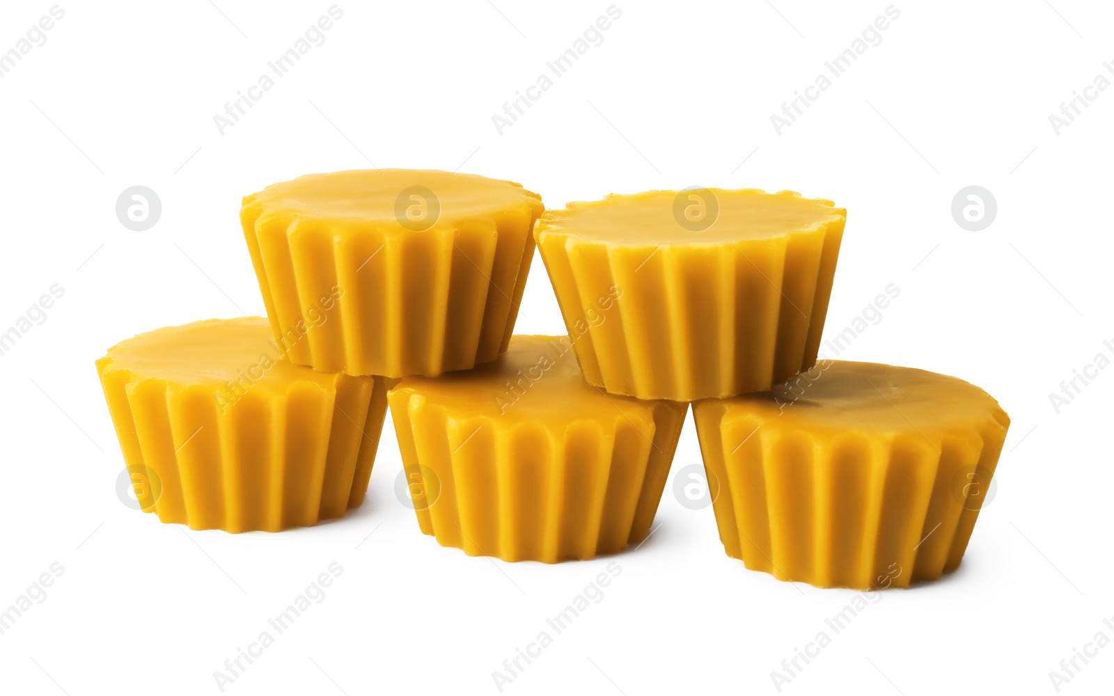 Photo of Natural beeswax cake blocks on white background