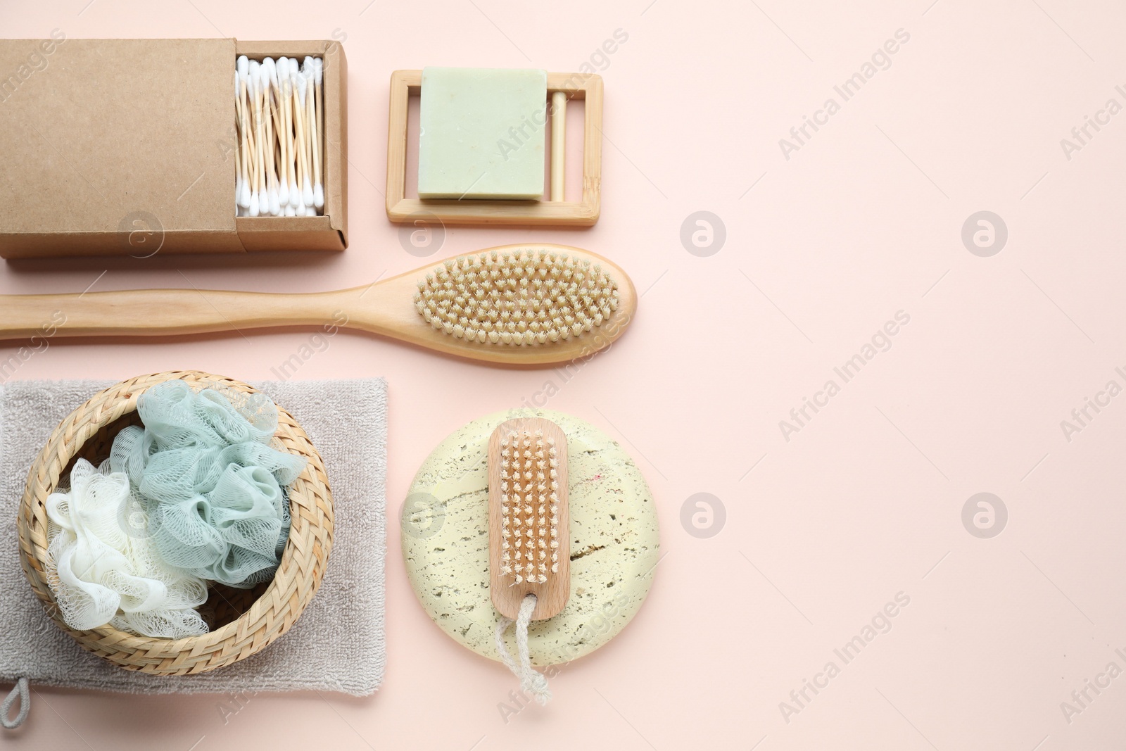 Photo of Bath accessories. Flat lay composition with personal care products on pink background, space for text