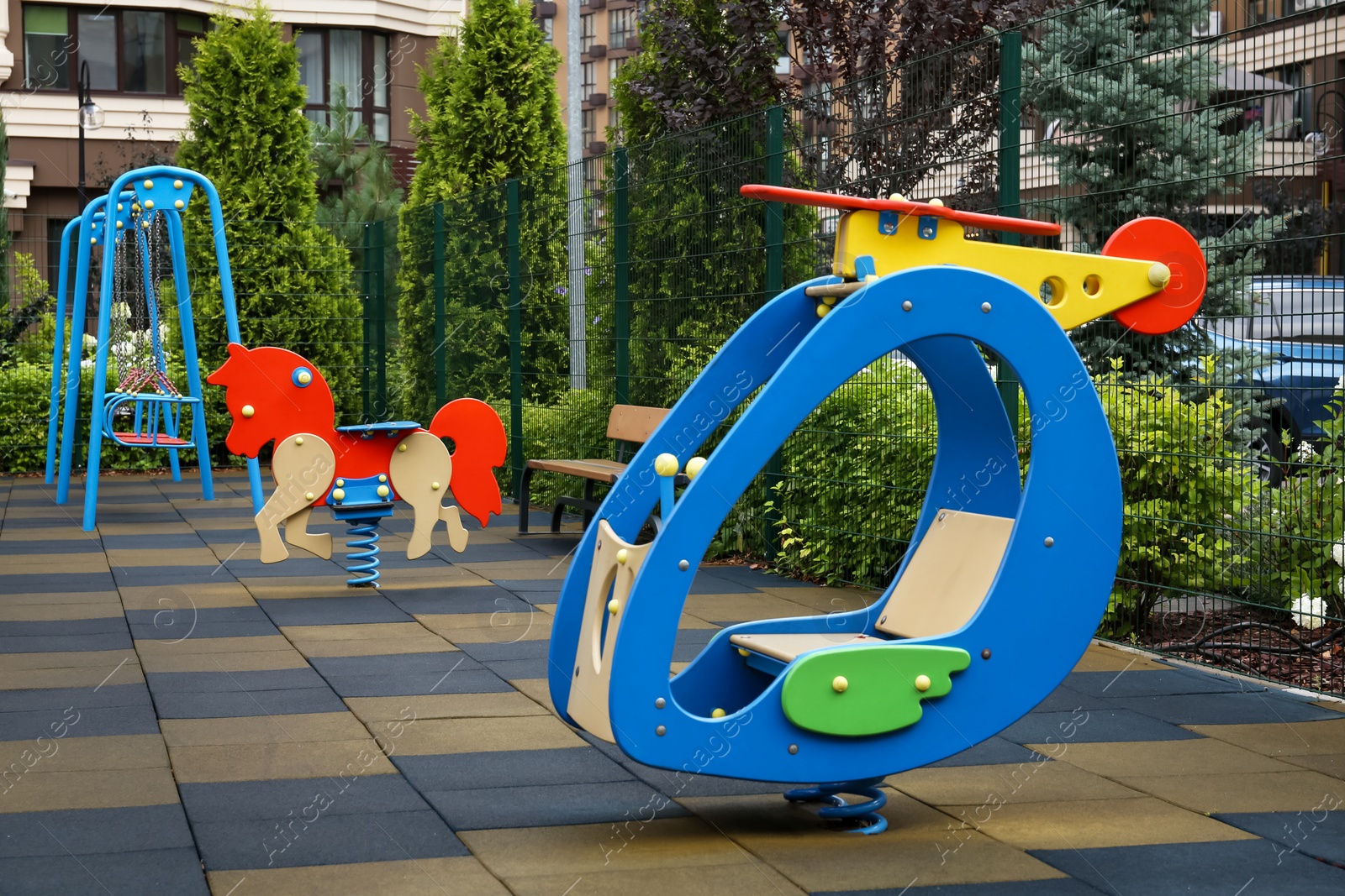 Photo of Empty spring rider on children's playground in residential area