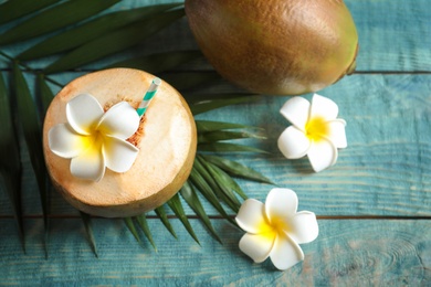 Photo of Composition with fresh green coconut on wooden table