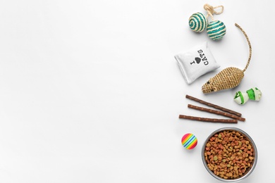 Photo of Flat lay composition with cat accessories and food on white background