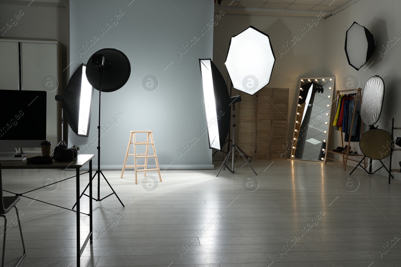 Photo of Interior of modern photo studio with professional equipment