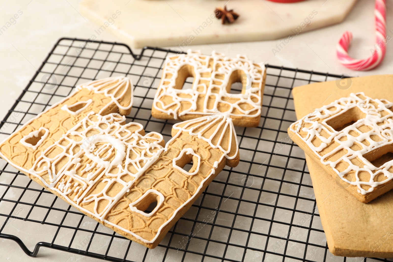 Photo of Parts of gingerbread house on cooling tray, closeup