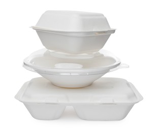 Stacked containers for food on white background