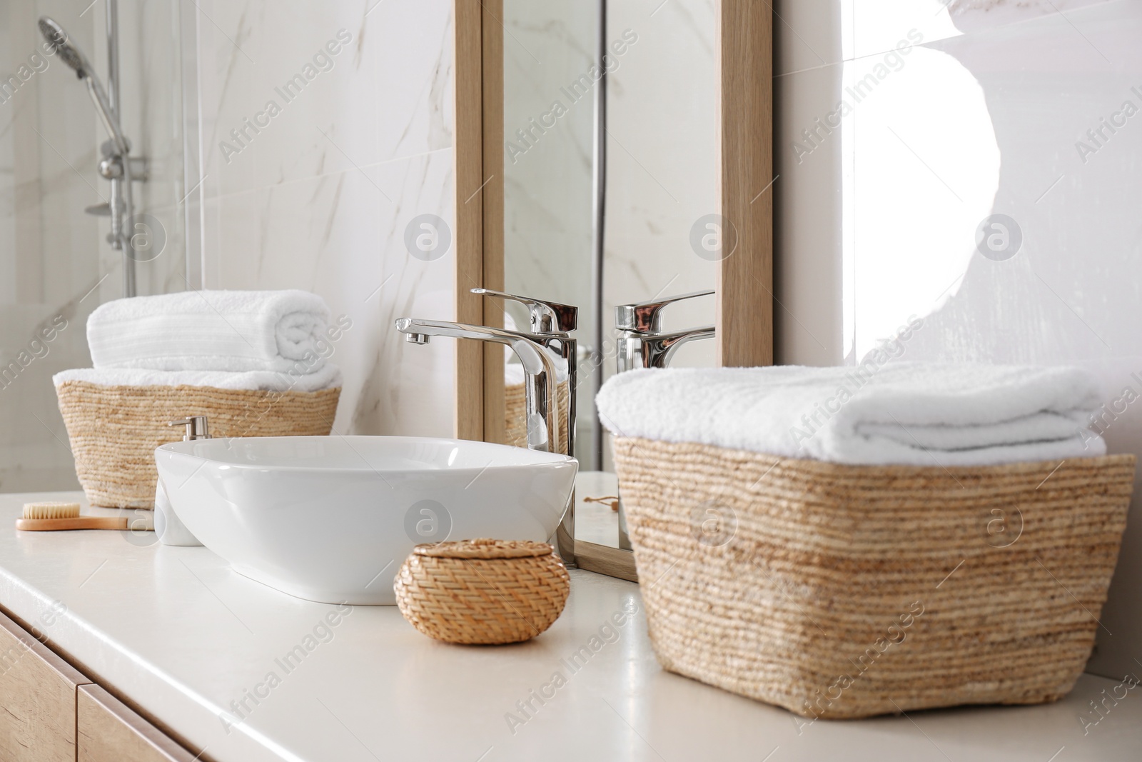 Photo of Large mirror and vessel sink in bathroom