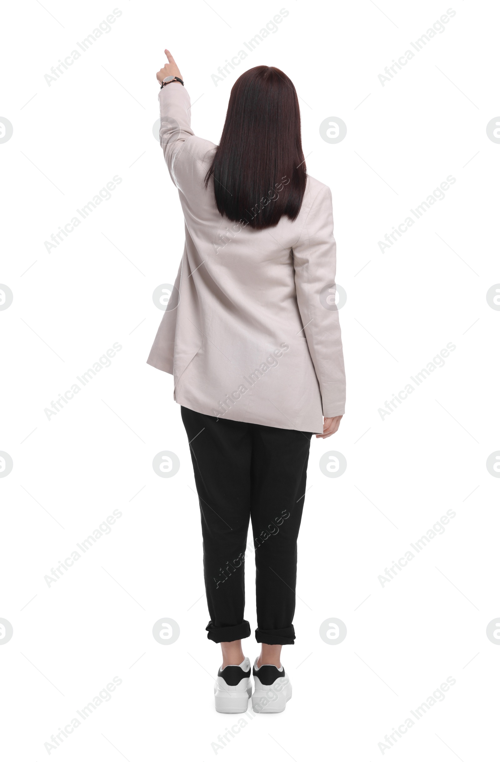 Photo of Businesswoman in suit pointing at something on white background, back view