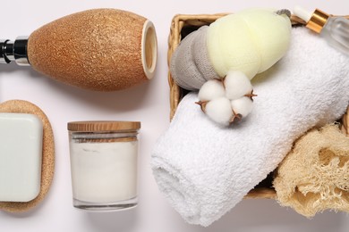 Photo of Bath accessories. Different personal care products and cotton flower on white background, flat lay
