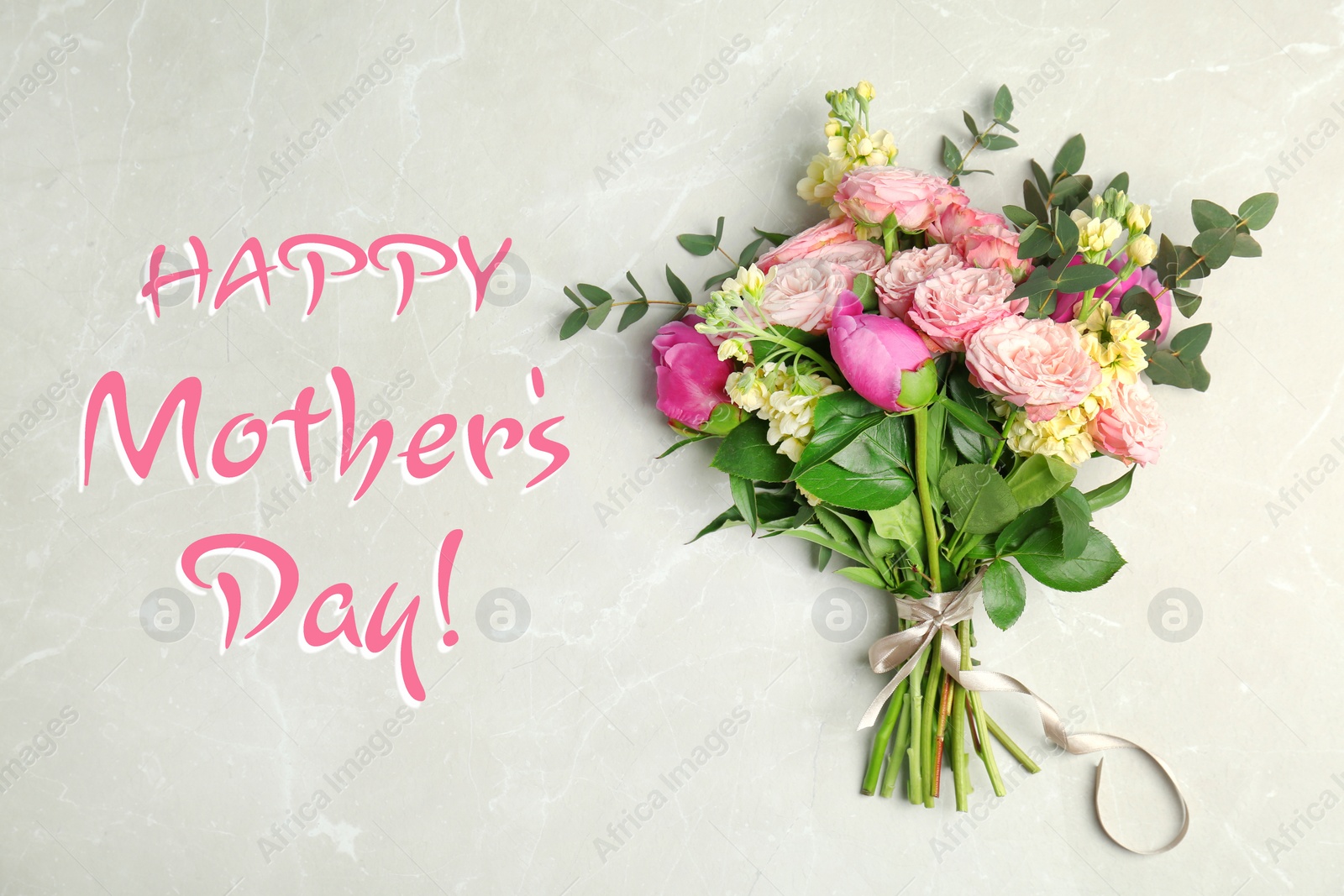 Image of Happy Mother's Day. Bouquet of beautiful flowers on light table, top view