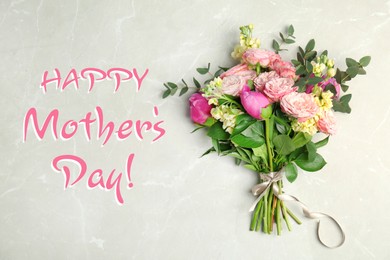 Happy Mother's Day. Bouquet of beautiful flowers on light table, top view