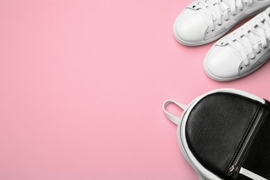 Flat lay composition with stylish shoes on color background, space for text