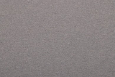 Texture of grey paper sheet as background, top view