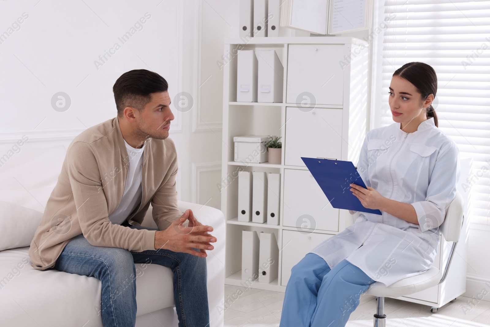 Photo of Man having appointment with STD specialist in clinic