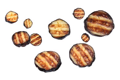 Slices of grilled eggplants in air on white background