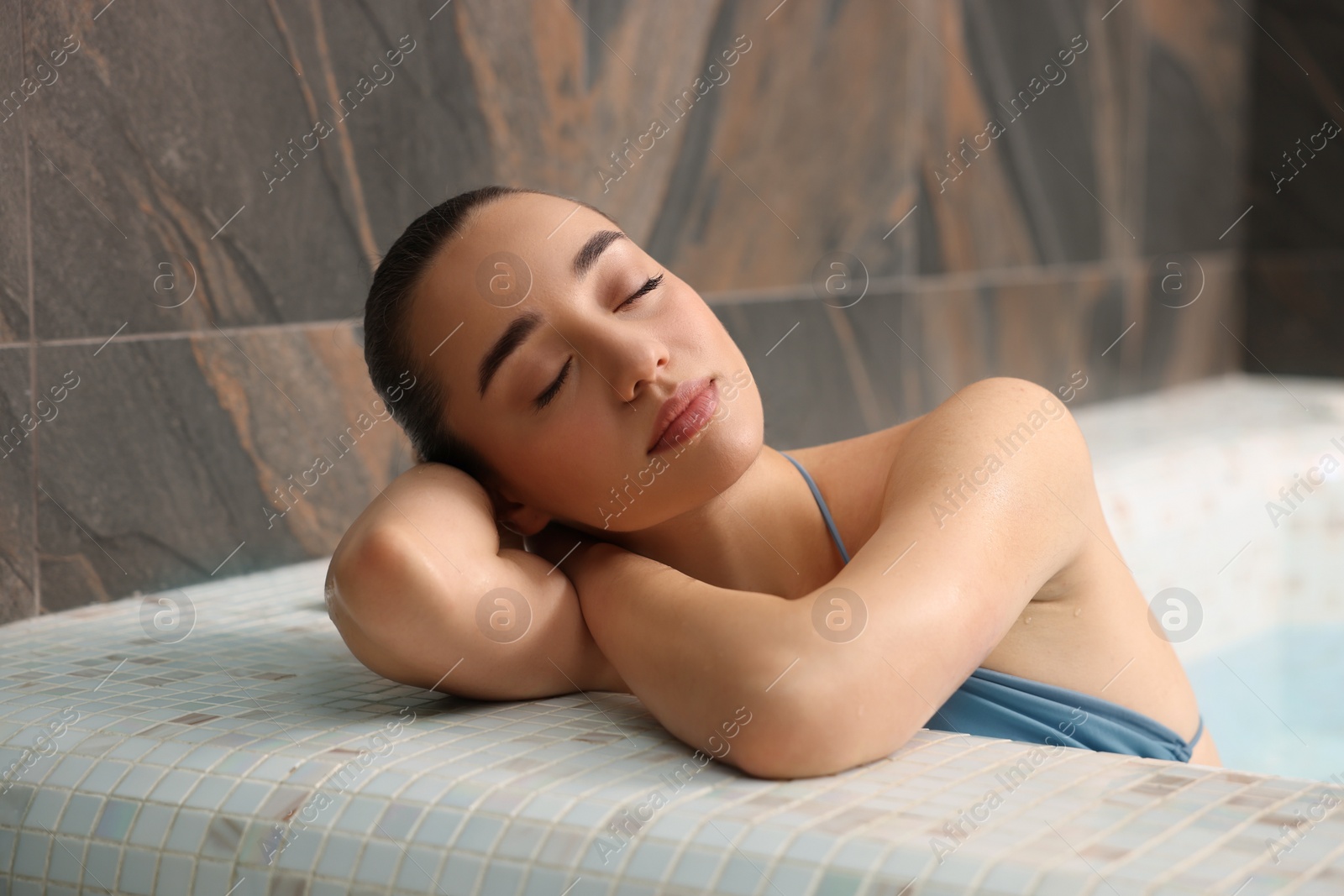 Photo of Beautiful woman relaxing in spa swimming pool