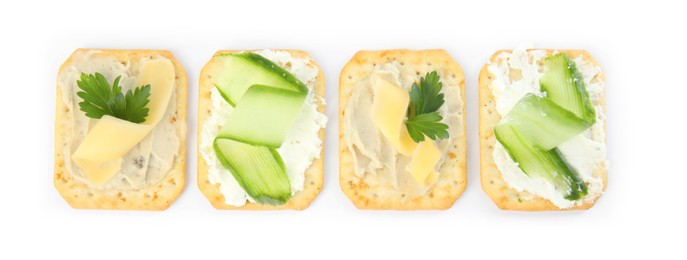 Photo of Delicious crackers with humus and cheese on white background, top view