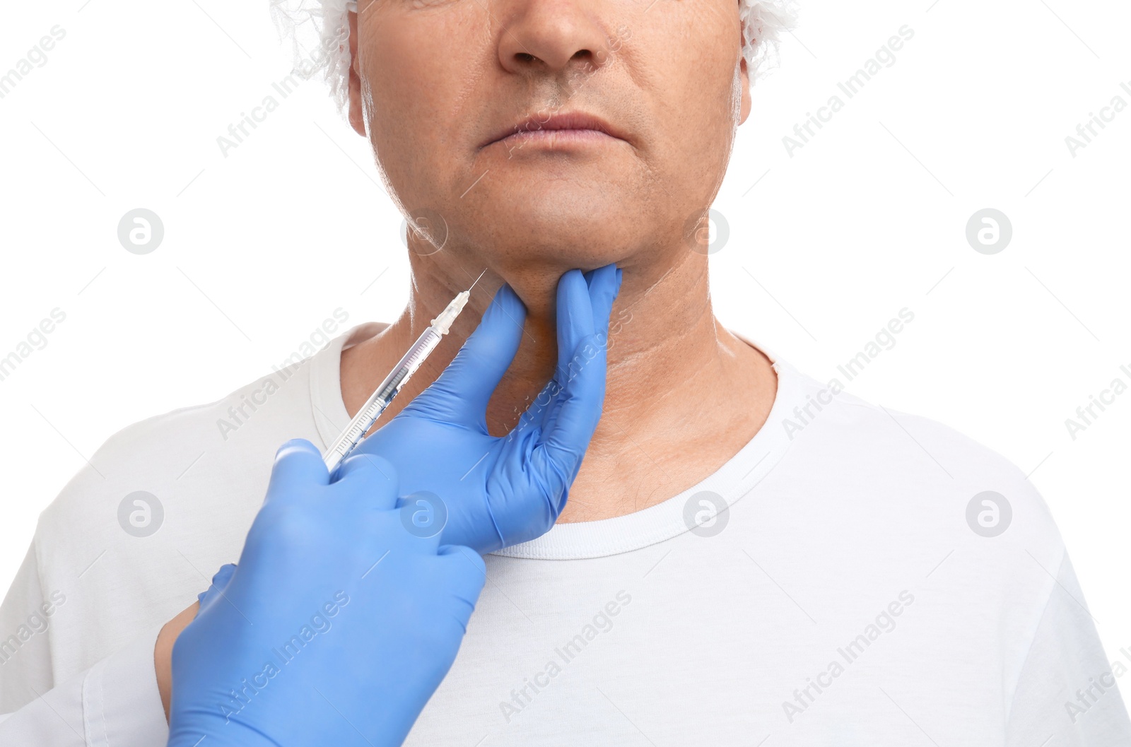 Photo of Mature man with double chin receiving injection on white background, closeup