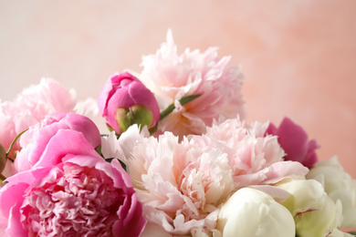 Photo of Beautiful peony bouquet on pink background, closeup