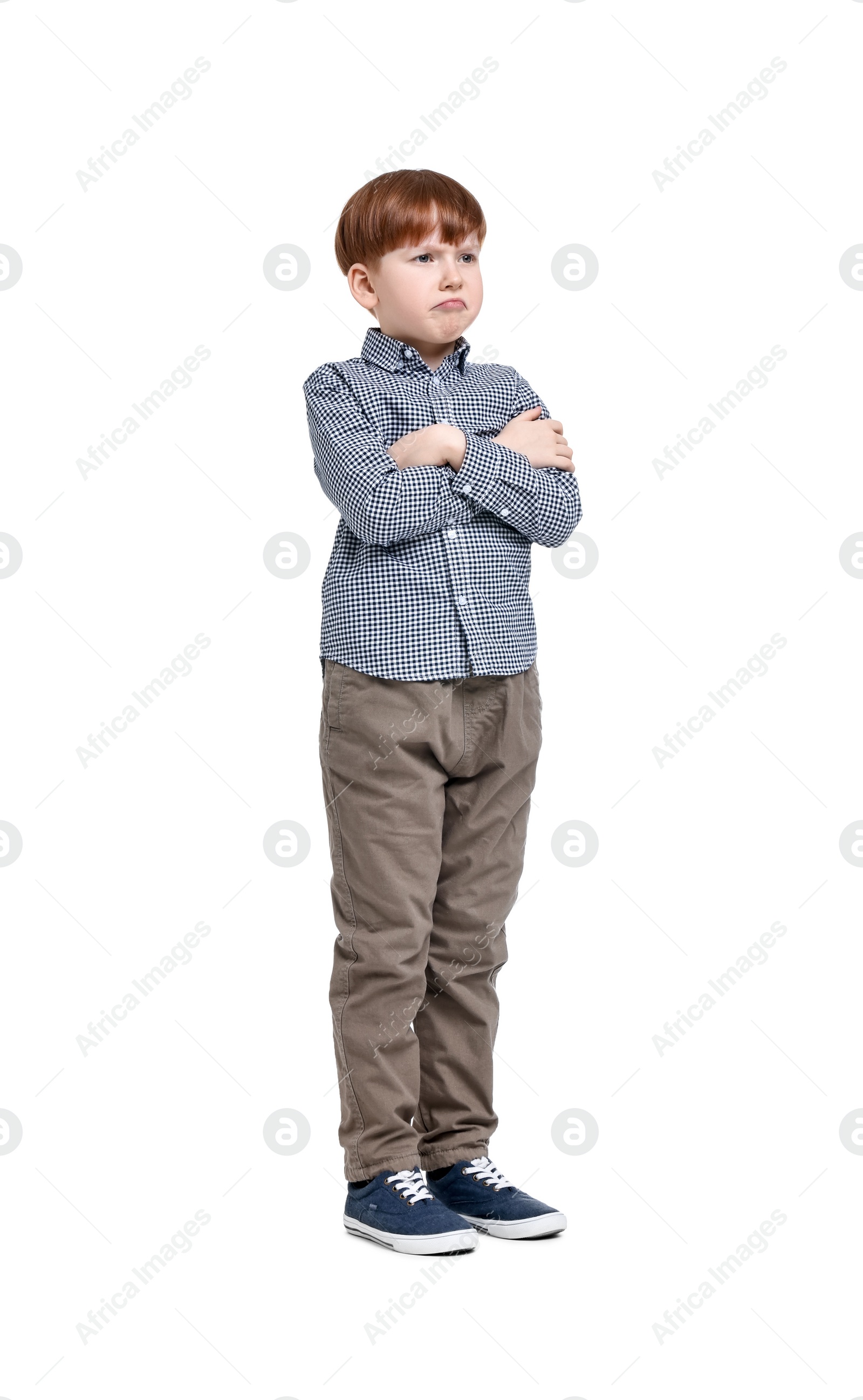 Photo of Little boy in shirt and pants on white background