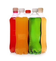 Photo of Bottles of soft drinks on white background