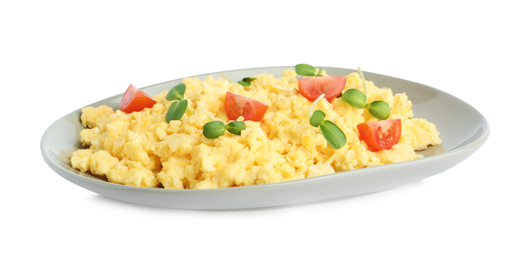 Photo of Tasty scrambled eggs with sprouts and cherry tomato isolated on white