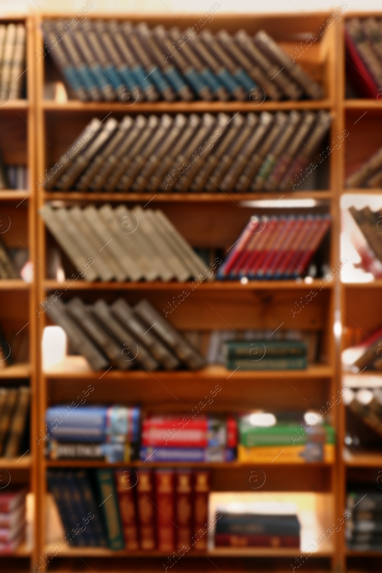 Photo of Blurred view of books on shelves in library