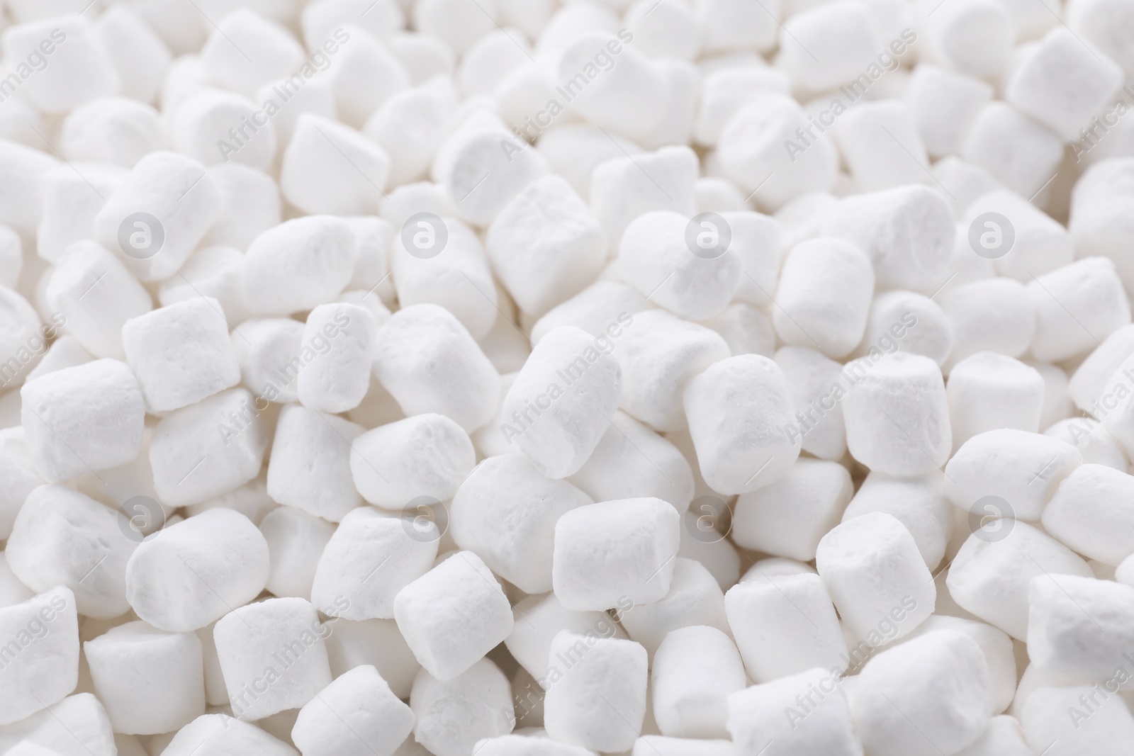 Photo of Many delicious sweet marshmallows as background, closeup