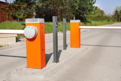 Photo of Orange road barriers outdoors on sunny day