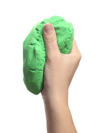 Photo of Woman playing with green kinetic sand on white background, closeup