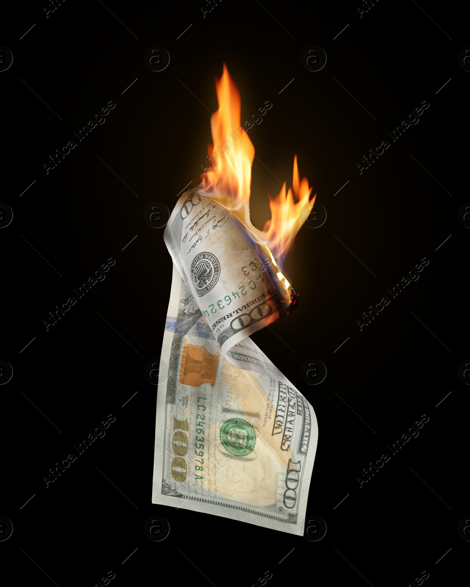 Image of One hundred dollar banknote burning on black background