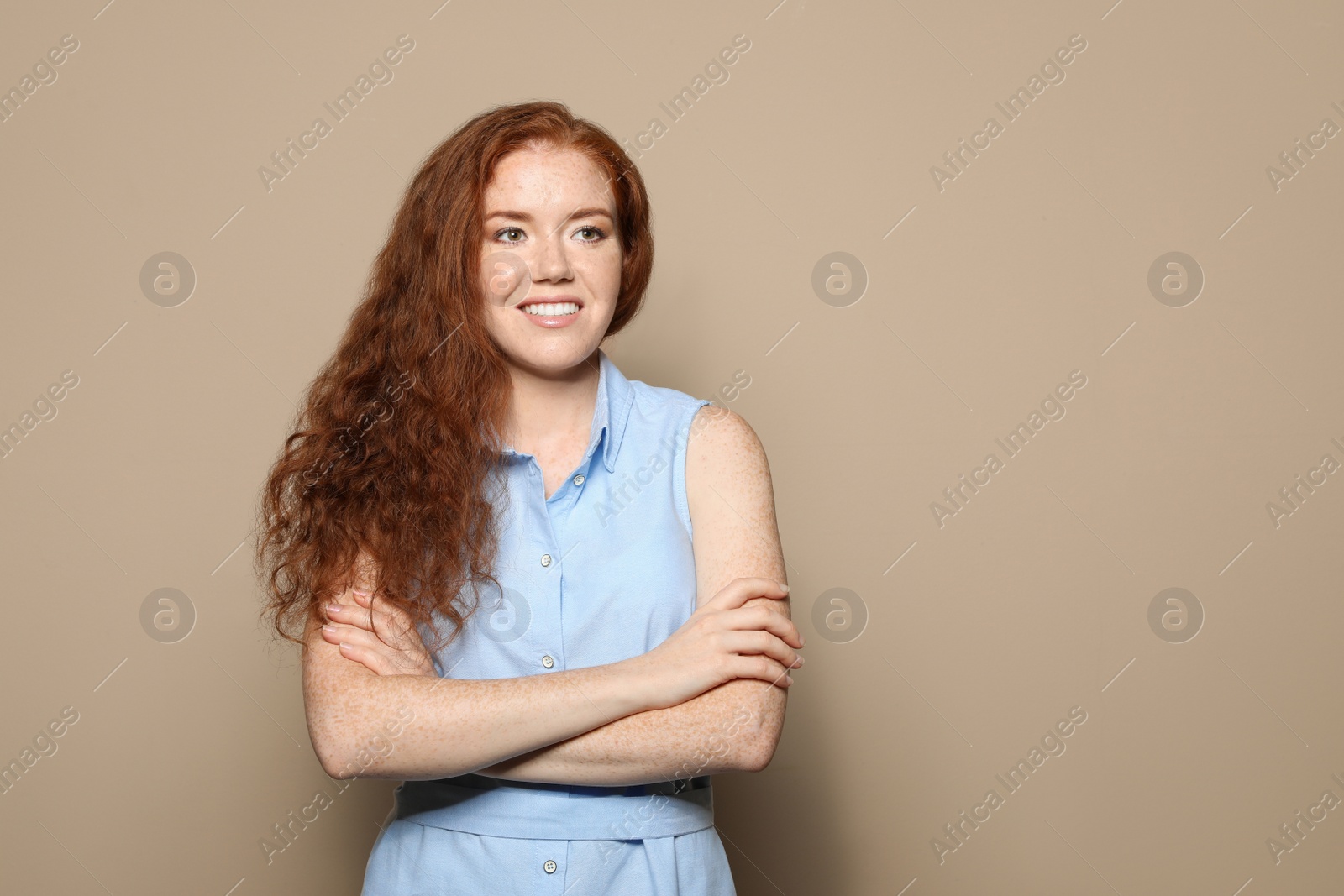 Photo of Portrait of young woman with beautiful face on beige background. Space for text