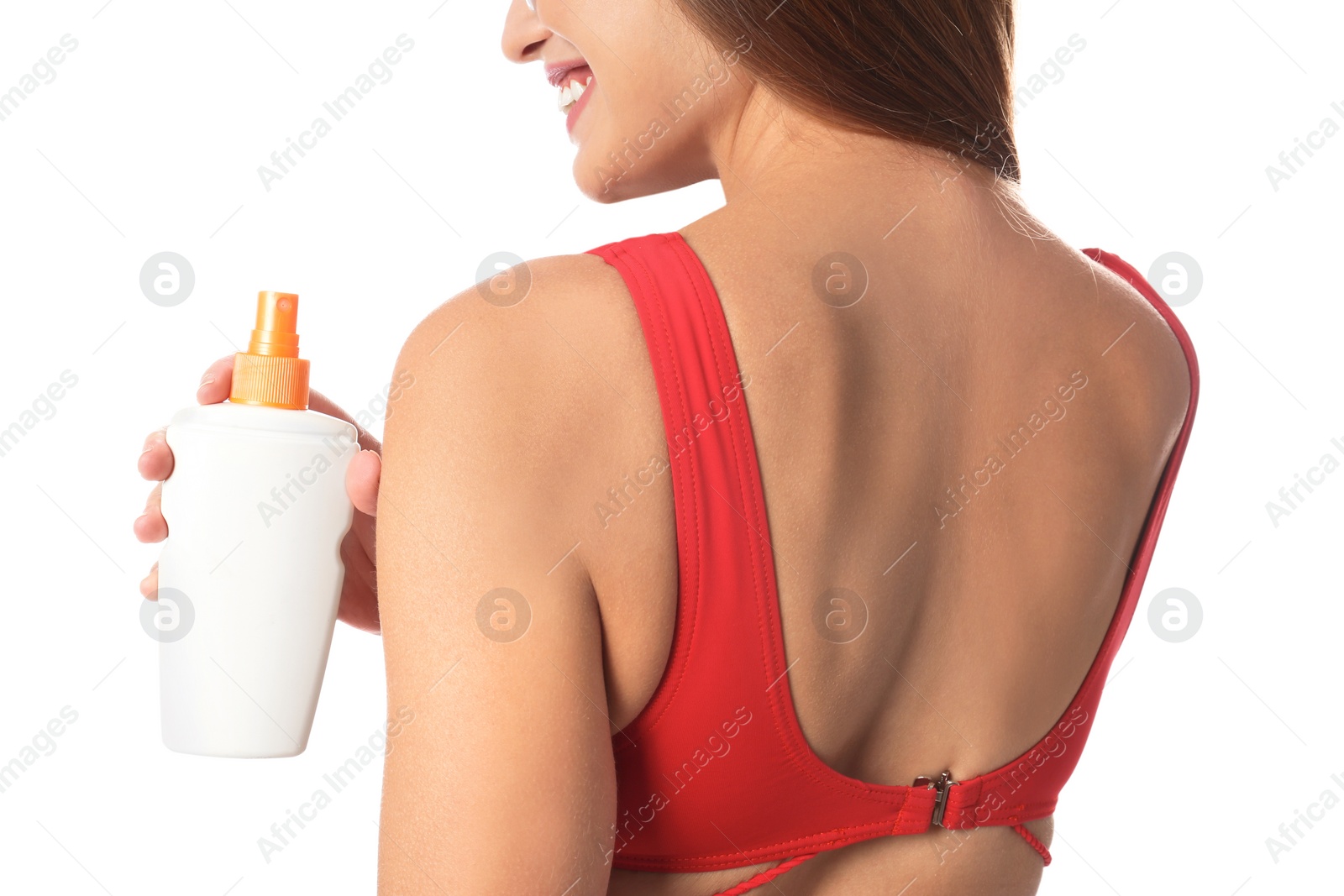 Photo of Woman with bottle of sun protection body cream on white background, closeup