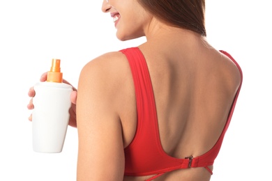 Photo of Woman with bottle of sun protection body cream on white background, closeup