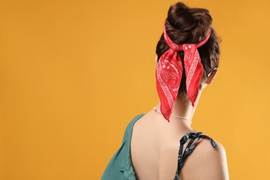 Photo of Woman with stylish bandana on yellow background. Space for text