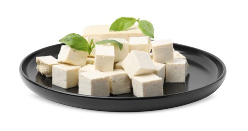 Photo of Plate with delicious tofu cheese and basil isolated on white