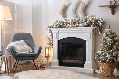 Fireplace in living room decorated for Christmas