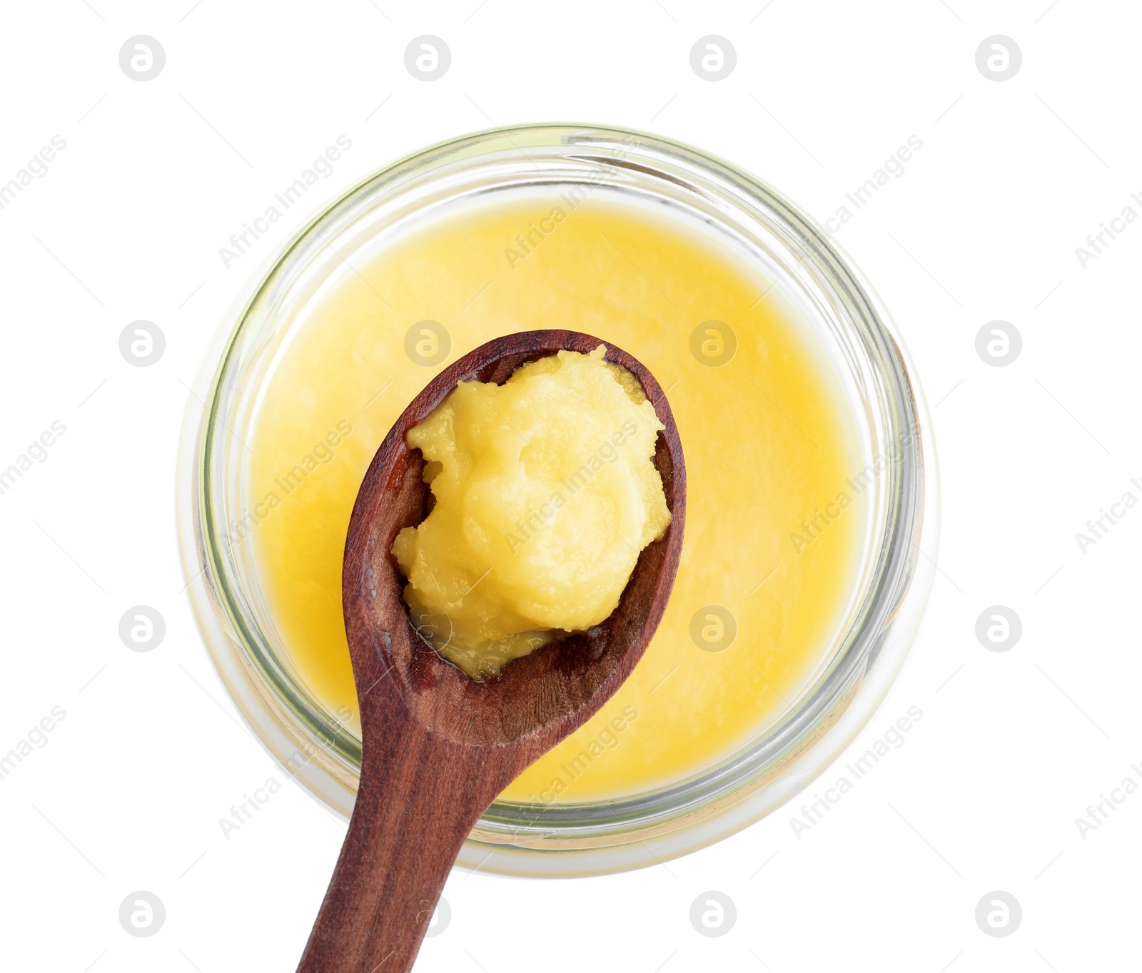 Photo of Glass jar and spoon of Ghee butter isolated on white, top view