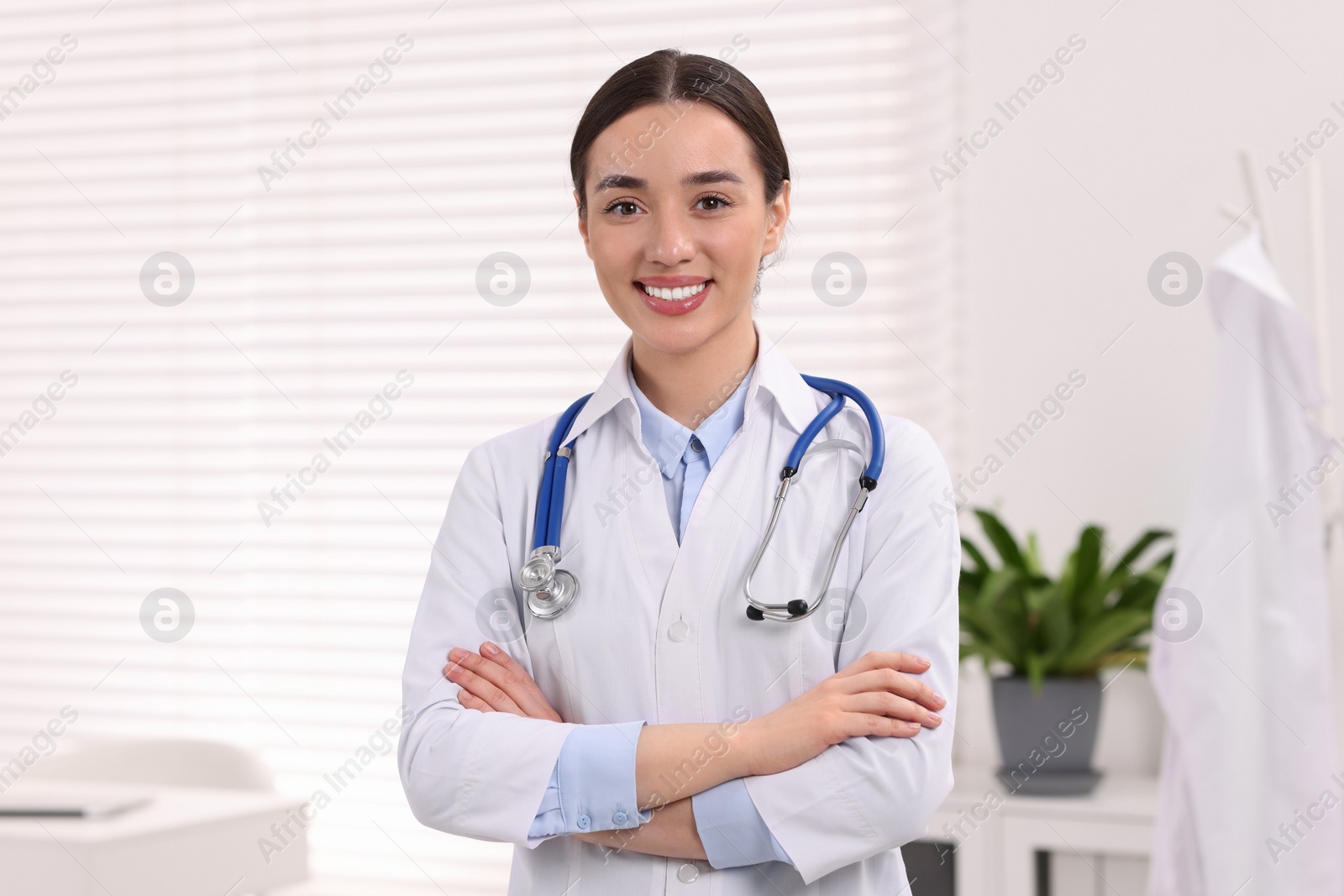 Photo of Portrait of medical consultant with stethoscope in clinic