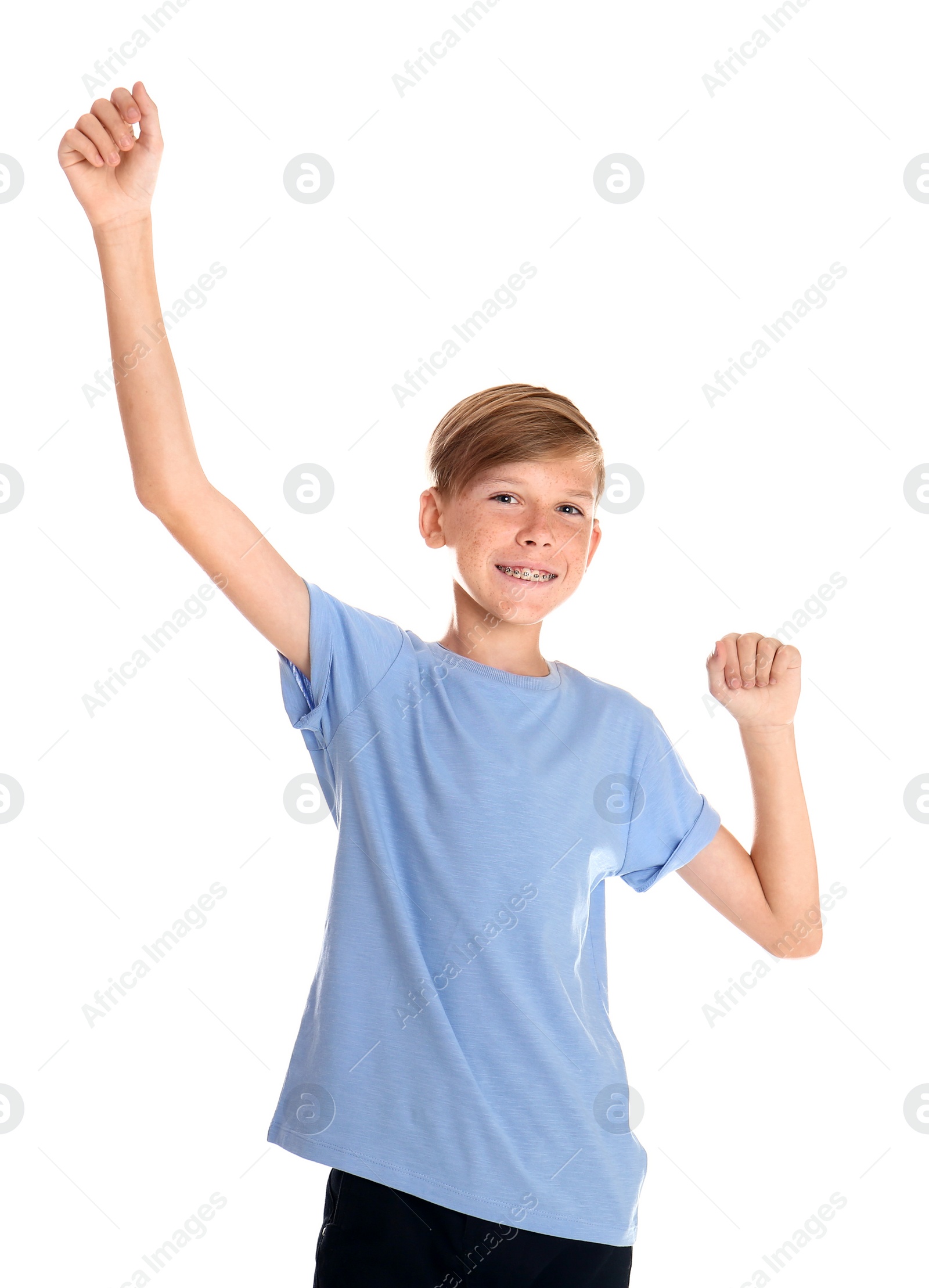 Photo of Portrait of young boy standing against white background